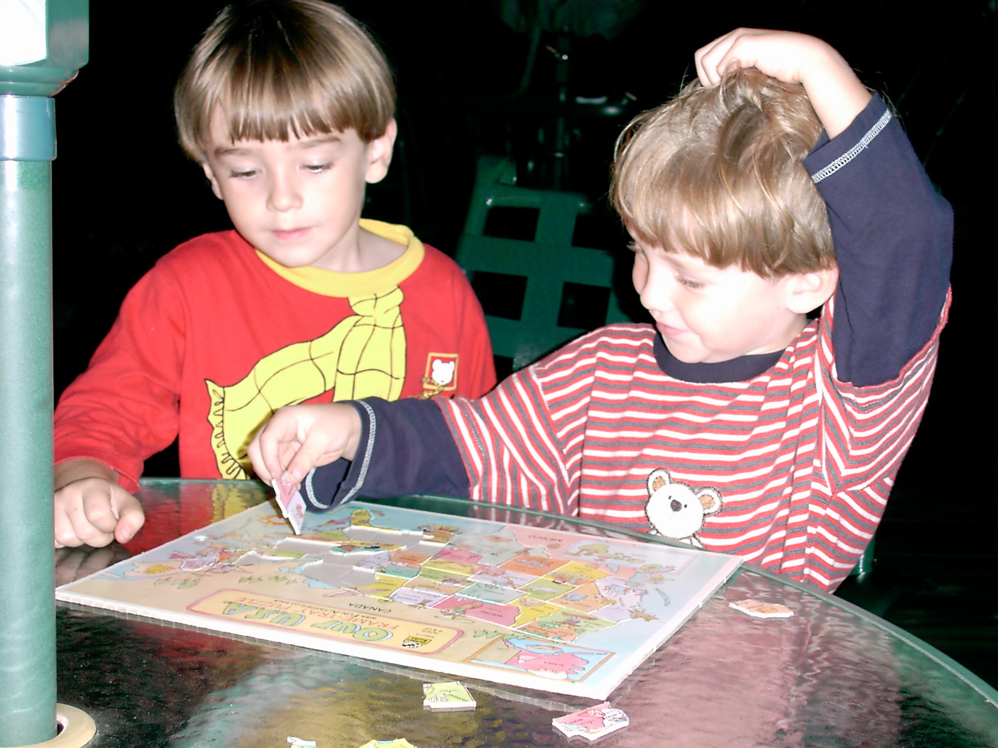 Chris and his brother working on a USA map puzzle